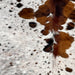 Closeup of this Colombian Speckled Tricolor Cowhide, showing white with black and brown speckles and spots, and cloudy speckles  (COTR1300)