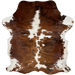 Colombian Tricolor Cowhide: has a brown and black, brindle pattern, with small and large, white spots, and it has long hair down the middle of the shoulder - 6'9" x 5'3" (COTR1374)