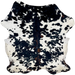 Large Colombian Tricolor Cowhide: white with large and small, black spots, with some brown mixed in down the spine and on the back, and it also has faint, cloudy black and brown spots - 7'10" x 6'2" (COTR1423)