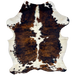 Large Colombian Tricolor Cowhide: white and off-white with a brown and black, brindle pattern down both sides of the back, and large and small spots that have a mix of brown and black - 7'7" x 5'7" (COTR1468)