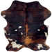Colombian Dark Tricolor Cowhide: has a mix of black and reddish brown, and a few white spots with black speckles - 6'4" x 4'10" (COTR1495)