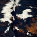 Closeup of this Colombian Tricolor Cowhide, showing a mix of black and reddish brown, and white spots with black speckles (COTR1506)