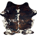 Large Colombian Tricolor Cowhide: has a mix of black and brown, with large and small, white spots - 7'7" x 5'10" (COTR1550)