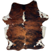 Colombian Tricolor Cowhide: has a red brown and black, brindle pattern, a few small, white spots down the middle, white on the belly and part of the shanks, and longer hair down the spine - 6'11" x 5'1" (COTR1579)