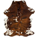 Colombian Tricolor Cowhide: has a reddish brown and black, brindle pattern, white spots that have black and brown speckles, and longer hair down the spine and on the belly - 7'2" x 5' (COTR1669)