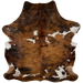 Large Colombian Tricolor Cowhide:  has a brown and black, brindle pattern, with a few white spots that have black and brown speckles in them - 7'6" x 5'8" (COTR925)