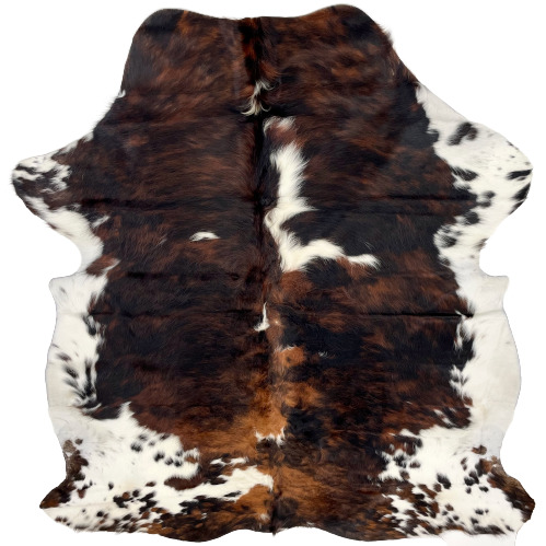 Colombian Tricolor Cowhide:  has a mix of black and reddish brown, with a few white spots in the middle, and white with brown and black spots on the belly and shanks - 6'4" x 5'2" (COTR930)