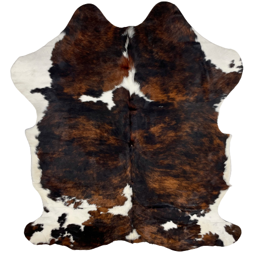 Colombian Tricolor Cowhide:  has a black and brown, brindle pattern, with a few white spots in the middle, and white with black and brown spots on the belly and shanks - 6'8' x 4'10" (COTR932)