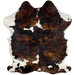 Colombian Tricolor Cowhide:  has a black and brown, brindle pattern, with a few white spots in the middle, and white with black and brown spots on the belly and shanks - 6'8' x 4'10" (COTR932)