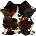 Colombian Tricolor Cowhide:  white with large and small spots that have a black and brown, brindle pattern - 6'5" x 5'2" (COTR934)