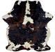 Colombian Tricolor Cowhide:  has a mix of black and brown, with a few off-white spots in the middle, some having small, black spots in them, and off-white with black and brown spots on the belly and shanks - 6'11" x 5'4" (COTR938)