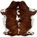 Colombian Tricolor Cowhide:  has a reddish brown and black, brindle pattern, with white spots down the spine, and white with brown and black spots on the belly and shanks - 6'11" x 5'3" (COTR940)