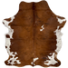 Colombian Tricolor Cowhide:  mostly brown, with a few small, black strips and a couple small white spots, and it has white, with brown spots and speckles on the belly and shanks - 6'7" x 5'1" (COTR991)