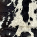 Closeup of this Dark Brown and White Spotted Goatskin, showing dark brown with white and off-white spots (GOAT230)