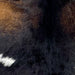 Closeup of this Goatskin, showing blackish brown with reddish brown speckles on the shoulder, and one small, white spot on the back (GOAT413)