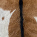 closeup of this Goatskin, showing brown with a large, white spot on the left side, and blackish brown down the spine  (GOAT443)