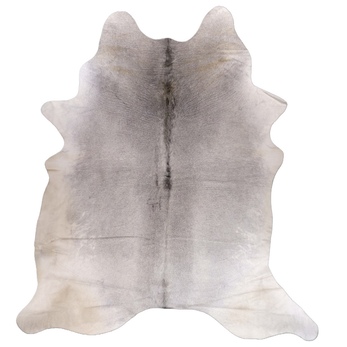 A natural cowhide rug with a gray and beige gradient, featuring a dark central stripe and subtle brown markings, shown flat against a solid white background.