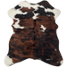 Tricolor Mini Cowhide:  has a brown and black, brindle pattern covering most of the hide, with a few small, white spots on the top half of the hide and on the shanks - 2'8" x 2'3" (MINI224)