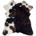 Tricolor Mini Cowhide:  has a mix black and dark brown covering most of the hide, and white with black and brown spots and speckles along the left side and top edge - 2'8" x 2'3" (MINI244)