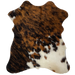 Tricolor Mini Cowhide:  has a brown and black brindle pattern, and off-white, with brown and black spots, on the lower right side - 2'8" x 2'3" (MINI245)