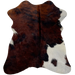 Tricolor Mini Cowhide:  has a dark brown and black, brindle pattern, with two small white spots on the left side of the belly, and a large white spot on the right fore shank and hind shank - 2'8" x 2'3" (MINI274)