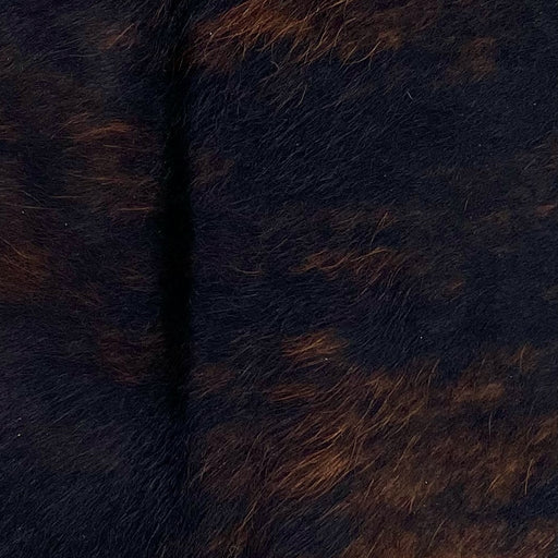 Closeup of this Brindle Mini Cowhide, showing a black and brown, brindle pattern (MINI276)