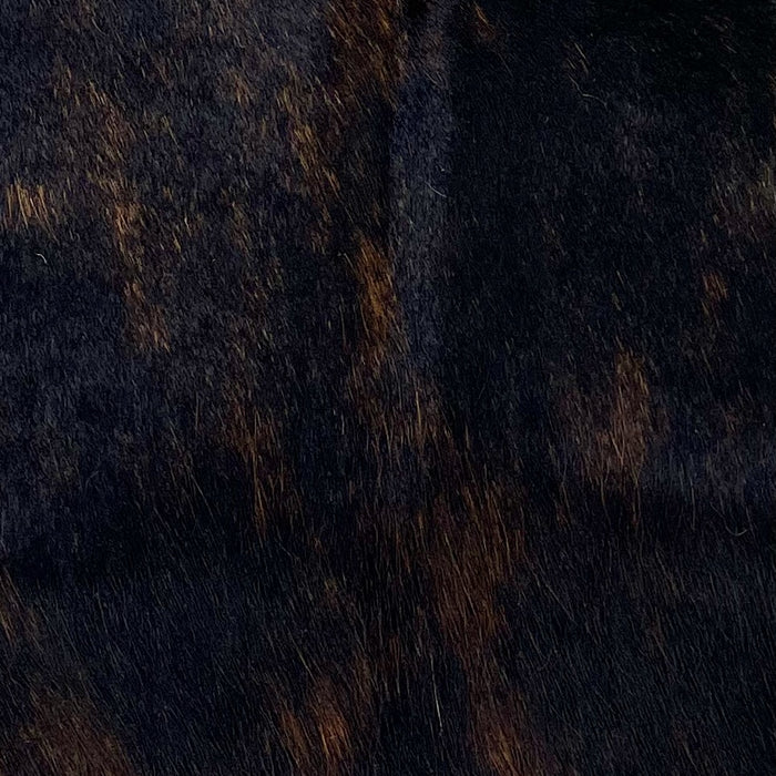 Closeup of this Dark Tricolor Mini Cowhide, showing a mix of black and brown (MINI295)