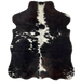 XS Dark Tricolor Cowhide:  mostly black, with dark brown mixed in, white down the spine, and a few white spots across the back and on the shanks - 4'6" x 3'5" (XS215)