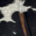 Closeup of this XS Cowhide, showing black, with one large, and a few small, white spots, and brown down the spine (XS312)