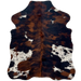 XS Tricolor Cowhide: has a black and reddish brown, brindle pattern, and large and small, white spots, the larger ones having black and reddish brown spots - 4'4" x 3'5" (XS580)