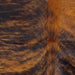 closeup of this XS Black and Reddish Brown Brindle Cowhide, showing reddish brown with black, brindle markings  (XS592)