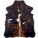 XS Tricolor Cowhide: has a brown and black, brindle pattern, a few small, white spots and white and brown down part of the spine - 4'4" x 3'4" (XS632)