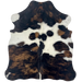 XS Tricolor Cowhide: has a mix of black and brown, and white across the middle, with spots that are black and brown - 4'4" x 3'5" (XS658)