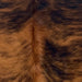 Closeup of this XS Reddish Brindle Cowhide, showing reddish brown with black, brindle markings (XS704)