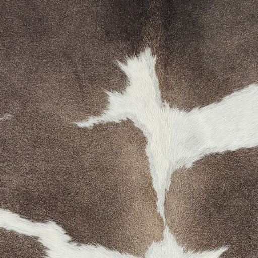 Closeup of this XS Cowhide, showing taupe with white spots (XS780)