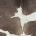 Closeup of this XS Cowhide, showing taupe with white spots (XS780)