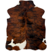 XS Tricolor Cowhide:  has a reddish brown and black, brindle pattern and one large and four small, white spots - 4'4" x 3'4"  (XS782)