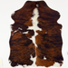 XS Tricolor Cowhide:  has a reddish brown and black brindle pattern, a few small white spots, and long white hair down the spine  - 4'4" x 3'5"  (XS789)