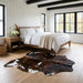 Tricolor cowhide rug CH-087 at the foot of a bed in a bright modern farmhouse bedroom with shiplap walls and white linen bedding