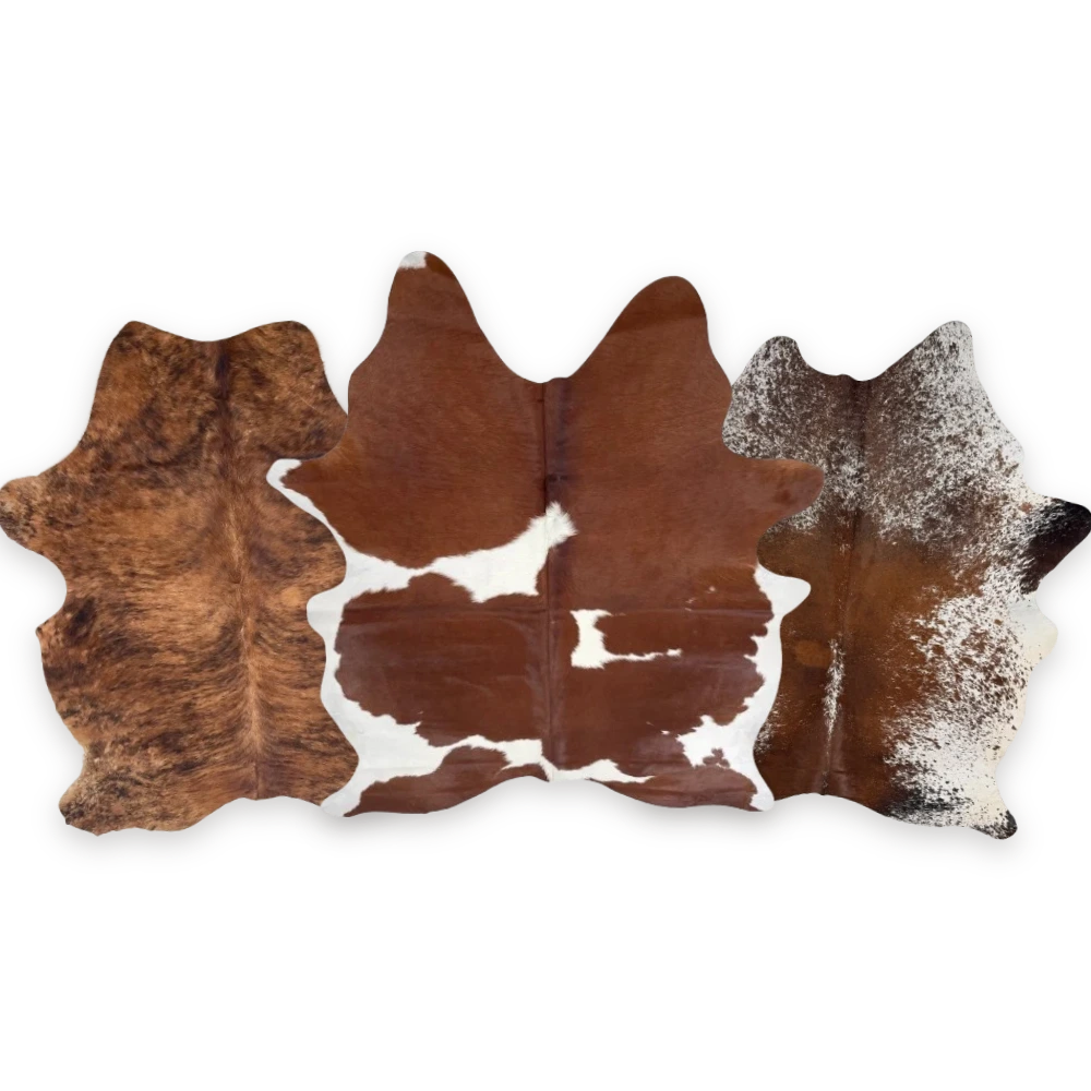 Brown cowhide rugs: brindle, brown and white spotted, and speckled