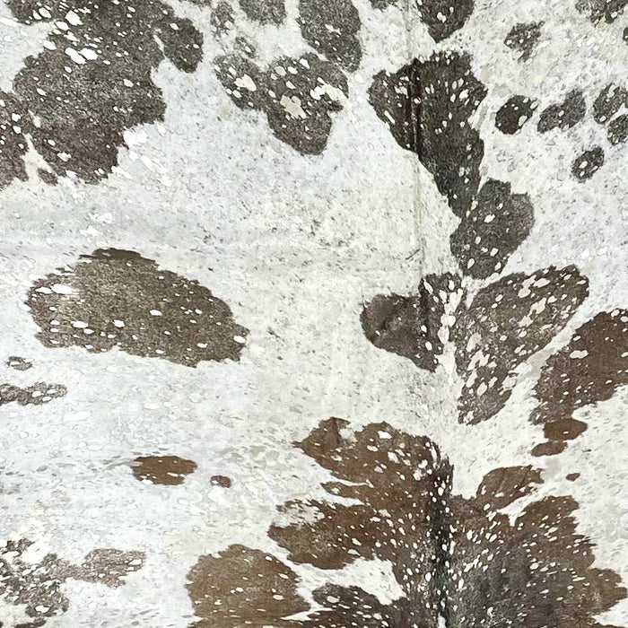 Closeup of this XXXL, Brown and White, Brazilian Cowhide, showing a metallic, Champagne Acid Wash	(BRAW363)