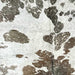 Closeup of this XXXL, Brown and White, Brazilian Cowhide, showing a metallic, Champagne Acid Wash	(BRAW363)