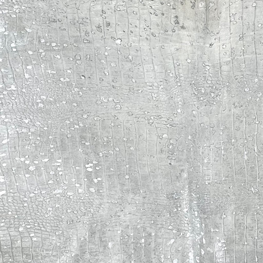 Closeup of this Large, Off-White, Brazilian Cowhide that has been embossed with a Croc Print and treated with a metallic, Silver Acid Wash (BRAW377)
