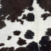 Closeup of this XXL, Brownish Black and White, Brazilian Cowhide, showing white with brownish black spots down the middle (BRBKW223)