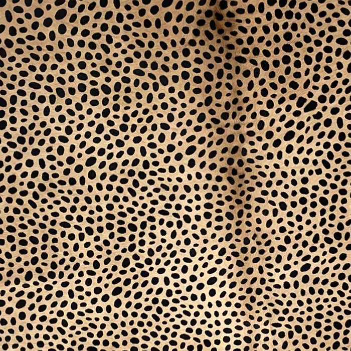 Closeup of this Light Brown, Brazilian Cowhide, showing a stenciled, Black, Cheetah Print (BRCH017)