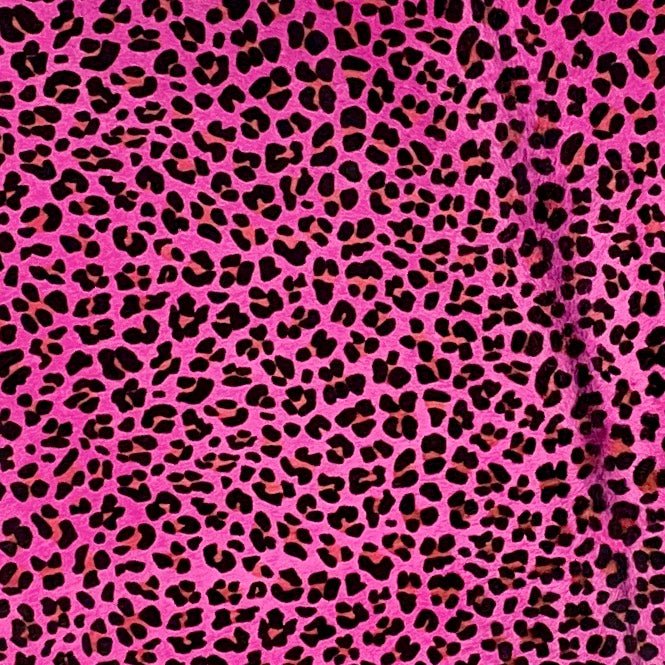 Closeup of this Brazilian Cowhide that has been Dyed Pink and stenciled with a brown and black Leopard Print (BRLP059)