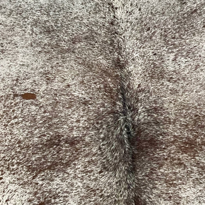 Closeup of this XL, Brazilian, Chocolate and Off-White, Speckled, Cowhide, showing off-white with chocolate speckles and spots (BRSP1557)