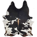 XXXL Black and White Speckled Brazilian Cowhide, 1 brand mark:  white with black speckles, large black spots, brown spots along the lower edge, and light brown down part of the spine, one brand mark near the lower edge, on the left side - 9' x 6'11" (BRSP1593)