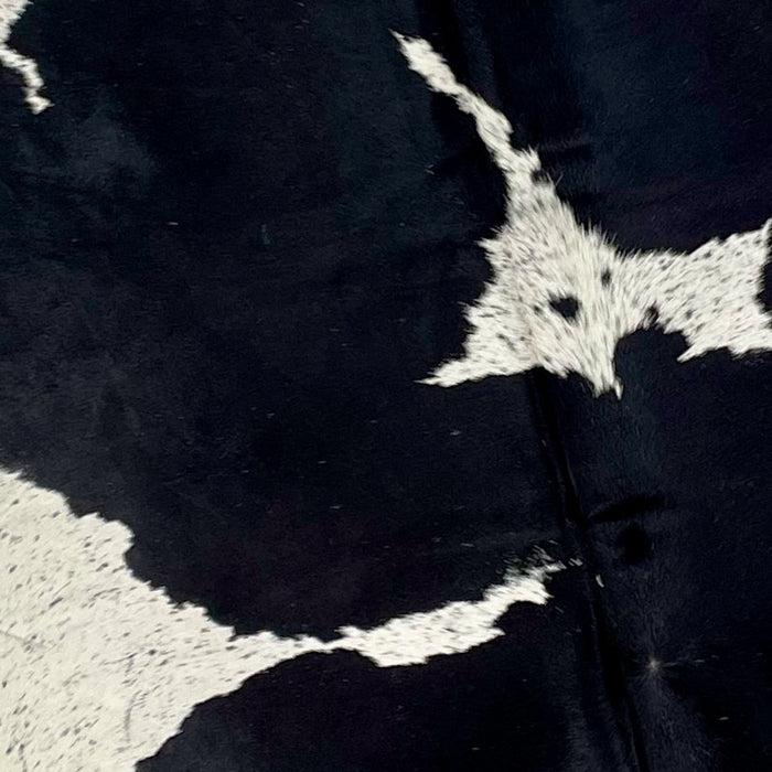 Closeup of this Large, Speckled, Brazilian Cowhide, showing white with black speckles, and large, black spots (BRSP1675)