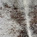 Closeup of this Large, Speckled, Brazilian Cowhide, showing white with dark brown speckles and spots (BRSP1703)